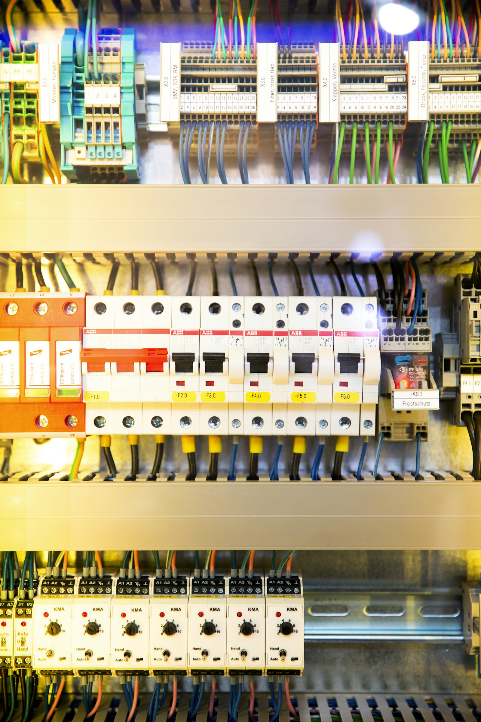 A live commercial control panel with labeled circuit breakers and color-coded conductors — the kind of buildout access ships every week.